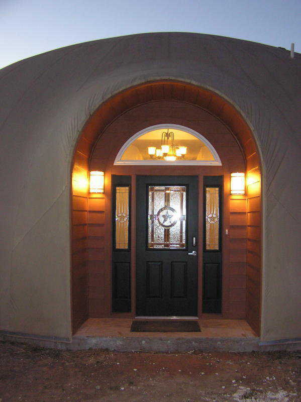 Welcoming entrance — A Texas Star dominates the decorative, cut-glass inserts in this ornate front door. Soft lighting adds a glowing warmth and welcome.