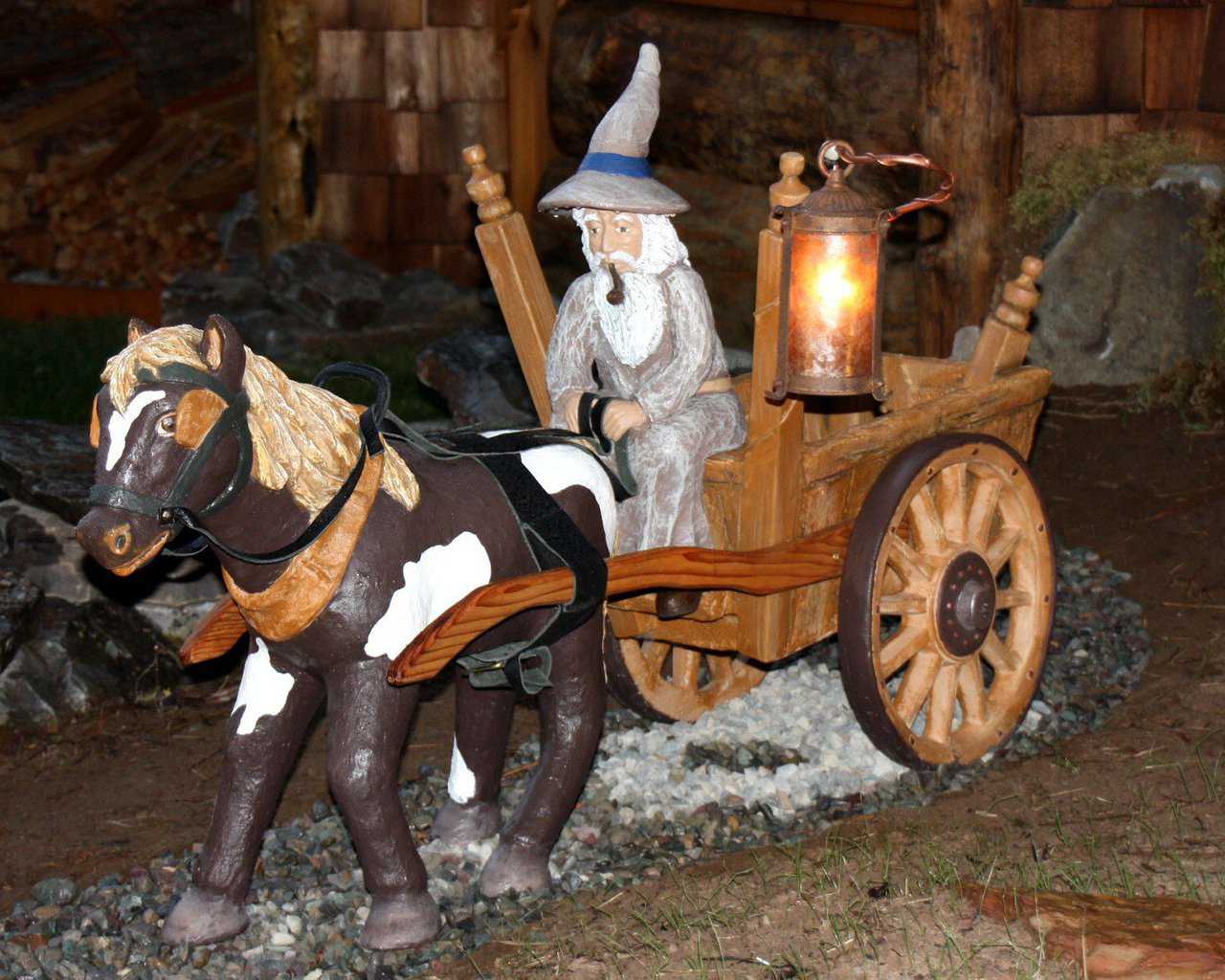 Gandolf in His Wagon — This beautifully designed piece is made entirely of cement and was handcrafted specifically for Hobbit House of Montana.