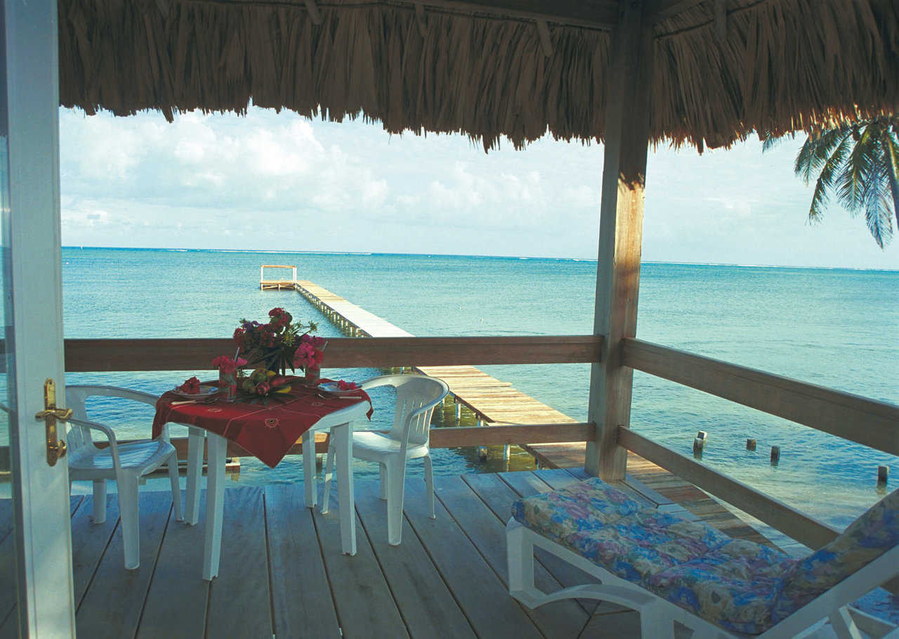Beautiful view — Imagine relaxing on this wooden deck, shaded by a thatched roof, catching the tropical breeze and listening to the gentle waves.