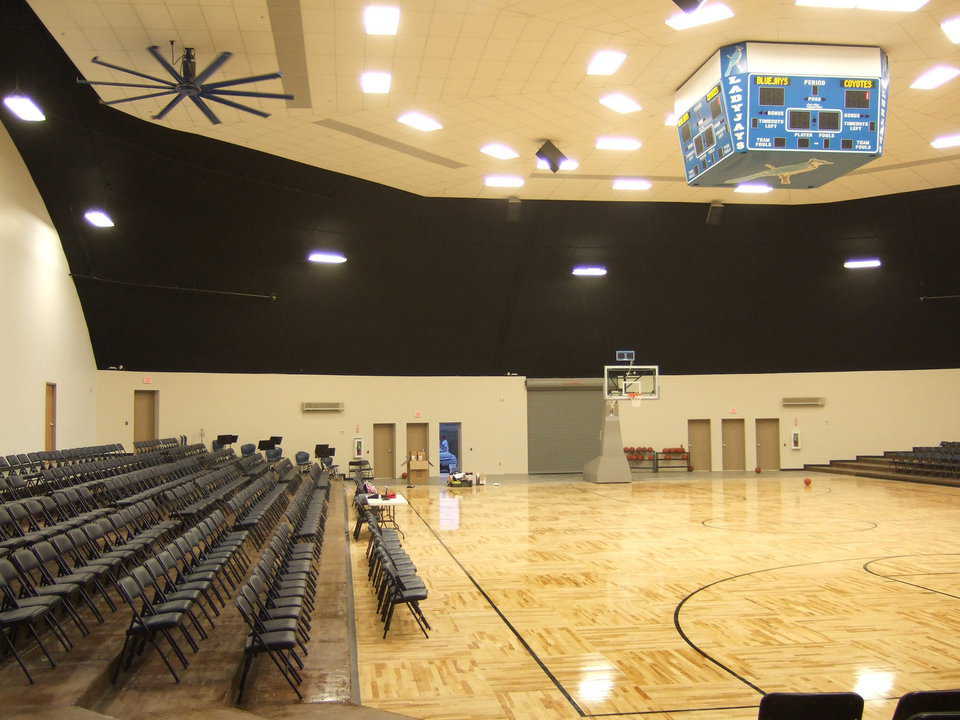 Super Features! — They include a regulation floor, suspended score board, ceiling fans and good lighting. In January 2010, permanent, comfortable seats will replace the temporary folding chairs.