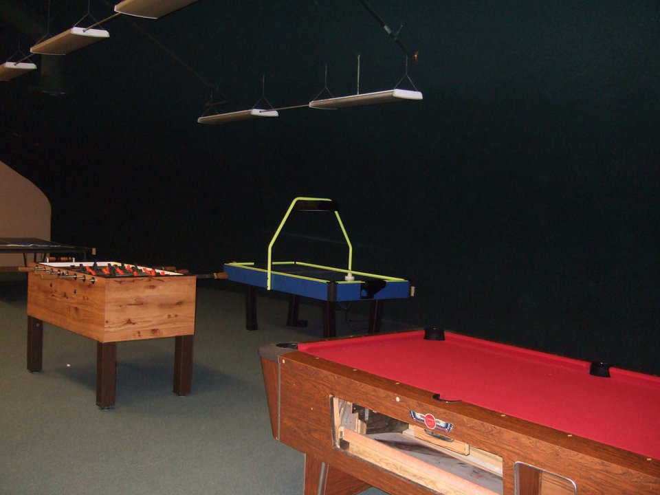 Mezzanine — Various game tables keep teenagers and young adults busy.