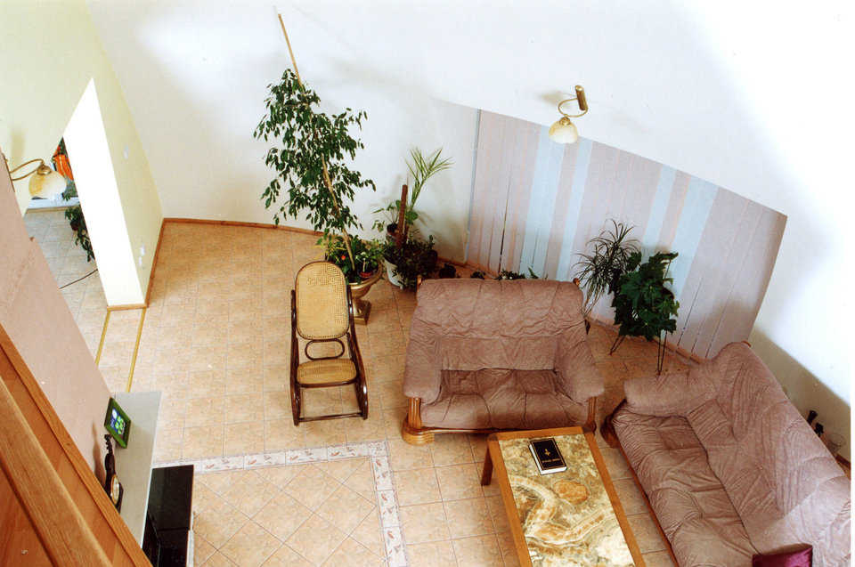 Living area — It has a ceramic tile floor and walls painted a warm gray.