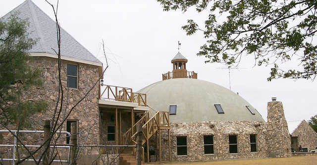 Bonnie and Bill McLeod built their hunting lodge in Blackwell, Texas: a Monolithic Dome with a 60-foot diameter, a 30-foot height, two stories, and 5200 square feet of living space that they named “our Dome on the Range”.
