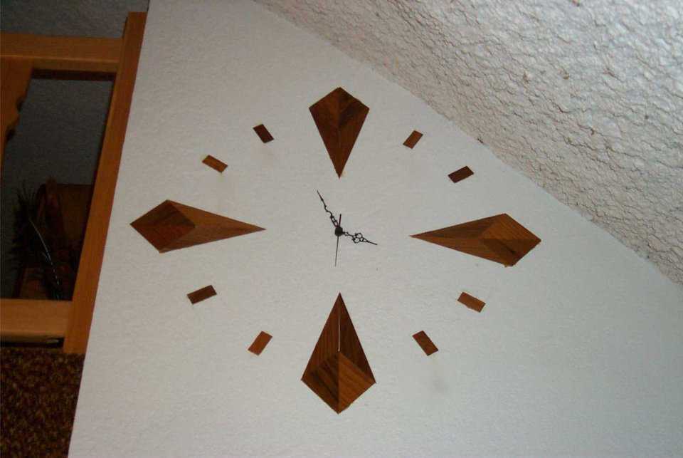Wall clock — A handmade clock, designed and built by Boyd Stewart is built into the wall.