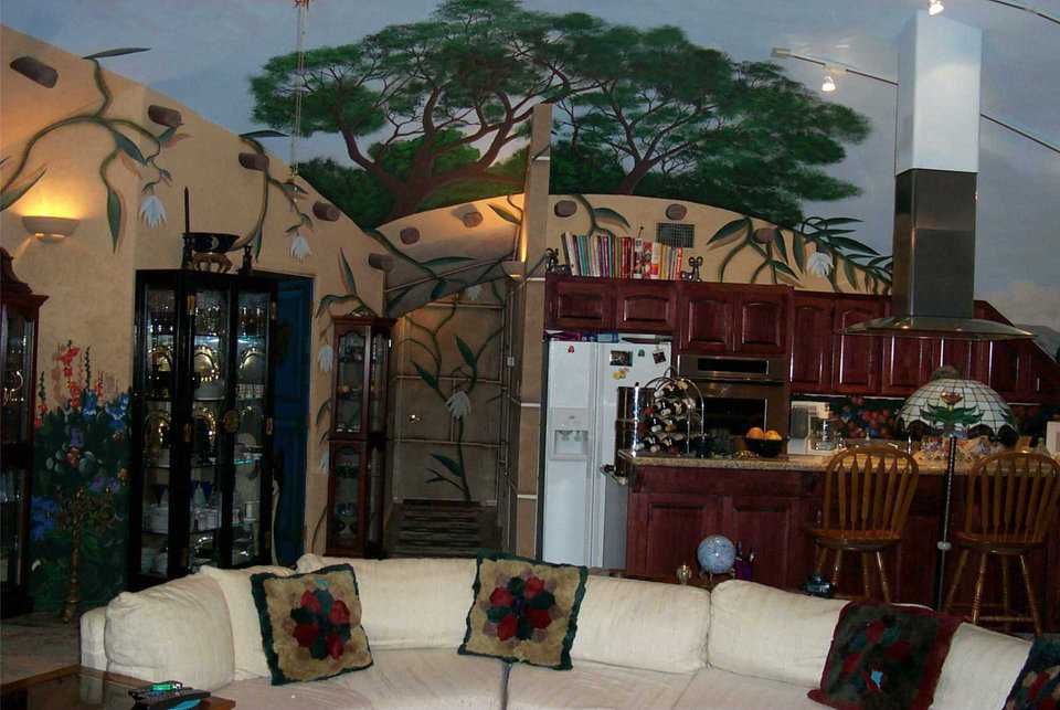 Entertaining Area — The perfect spot for entertaining: comfortable sofa and chairs backed by a casual refreshment bar and stools.