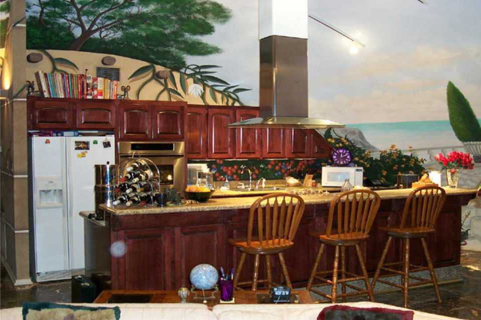Kitchen — Located in the central dome, the kitchen has a large bar area and a stunning marble floor that extends throughout the dome.