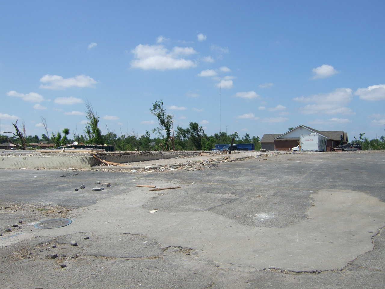 Note the concrete foundations. Unexplainably, entire blocks of homes were flattened, yet one was left virtually untouched.