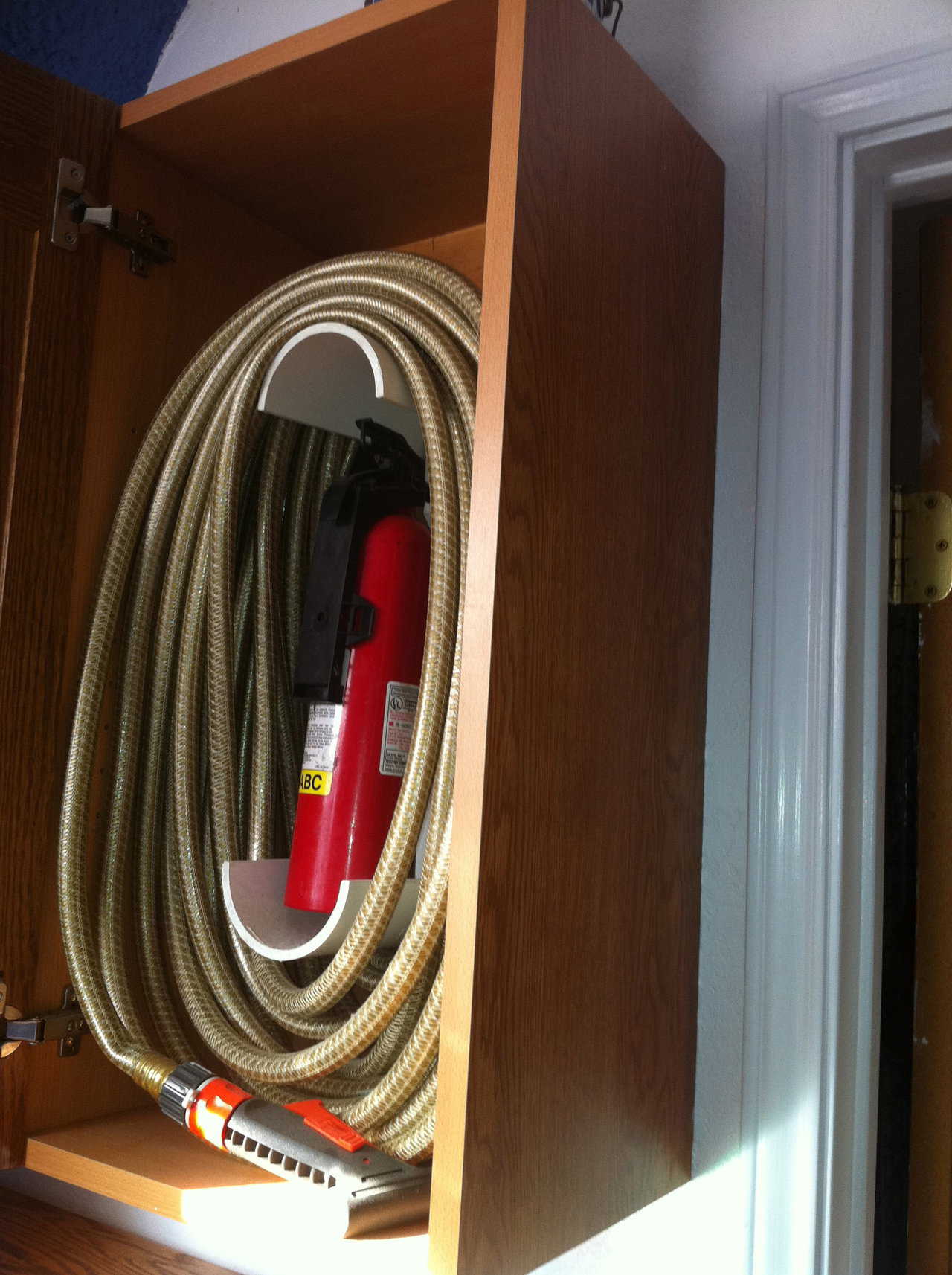 I have a good quality hose, in the right length for my home, rolled into the cabinet.