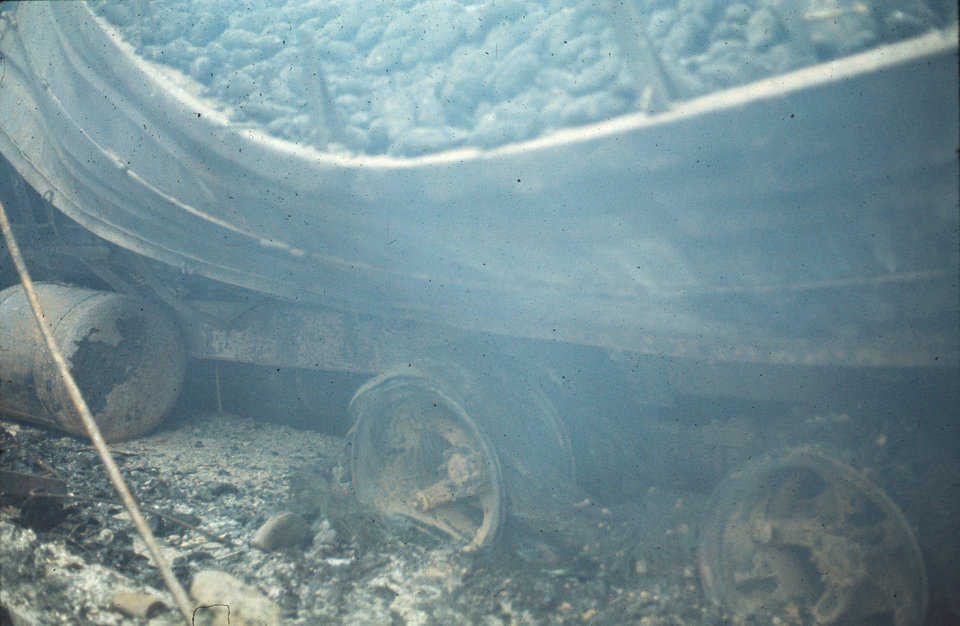 Fire goes from bad to worse.
The truck tires fed the fire with heat and smoke. The insulation increased temperature which increased the speed at which the tires burned. The increased heat drooped the steel and melted the aluminum into puddles.