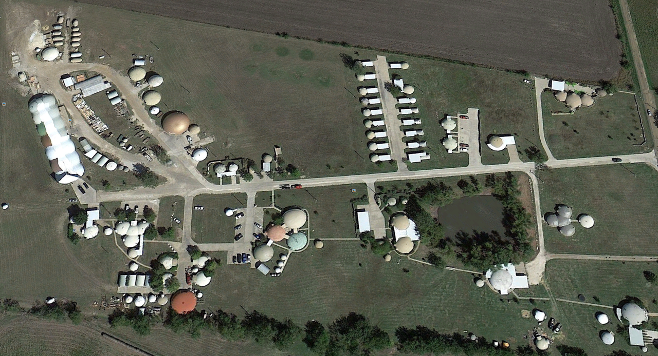 This is an aerial view of Monolithic’s headquarters in Italy, Texas. Our campus includes our offices; training center; Bruco, our Airform factory; both large and small Monolithic Dome homes and rentals. Research is a prime activity and goal. For example, we check the practicality and durability of items such as exterior finishes, smoke detectors, water purifying systems, etc.