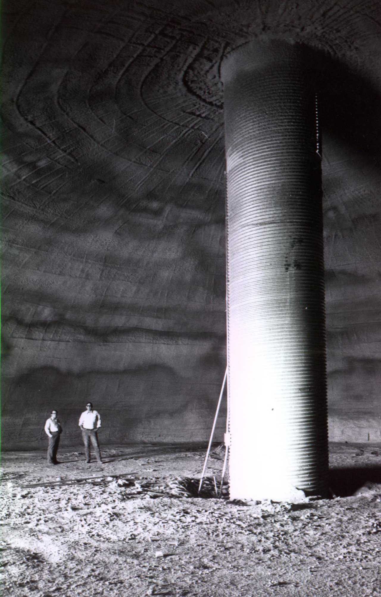 David B. South and the proud owner of the first Monolithic Dome potato storage built in Shelley, Idaho in 1975 survey the dome’s interior. That interior was soon filled with potatoes stacked into piles, often 20 feet high.