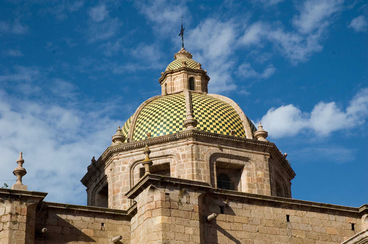 Morelia, Mexico — This brightly tiled dome sits beneath a clear, blue sky.