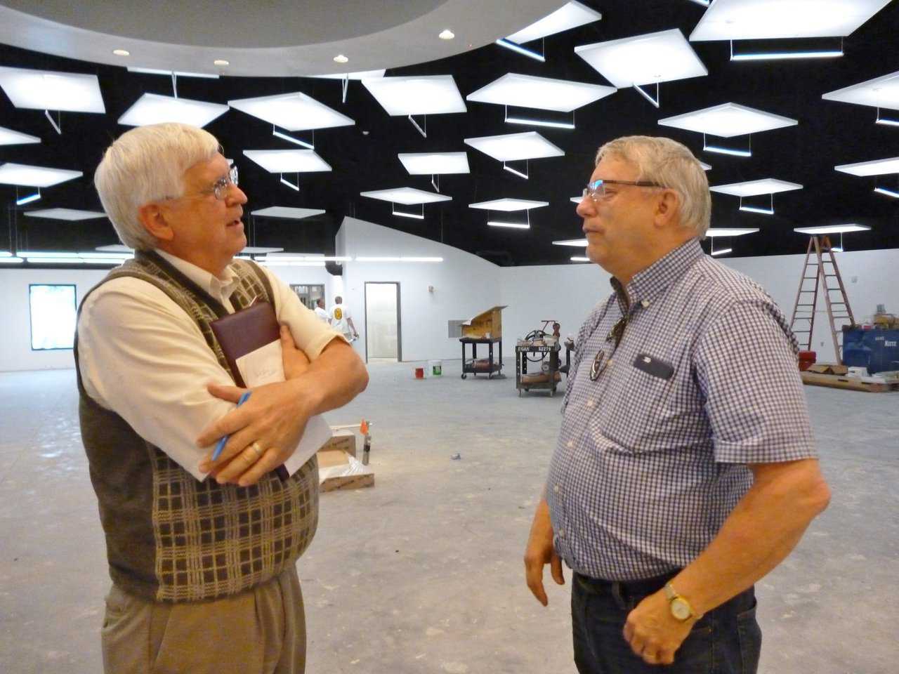Kasson Library director Art Tiff speaks with architect Leland Gray