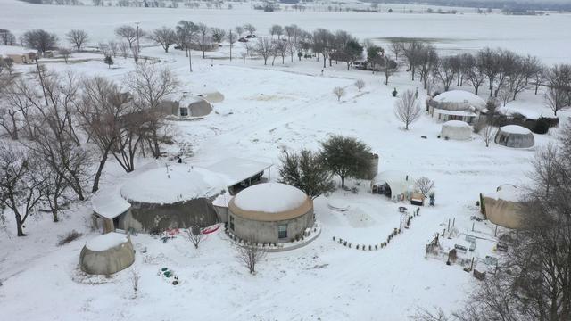 Winter snow covering Monolithic Dome Research Park near Italy, Texas