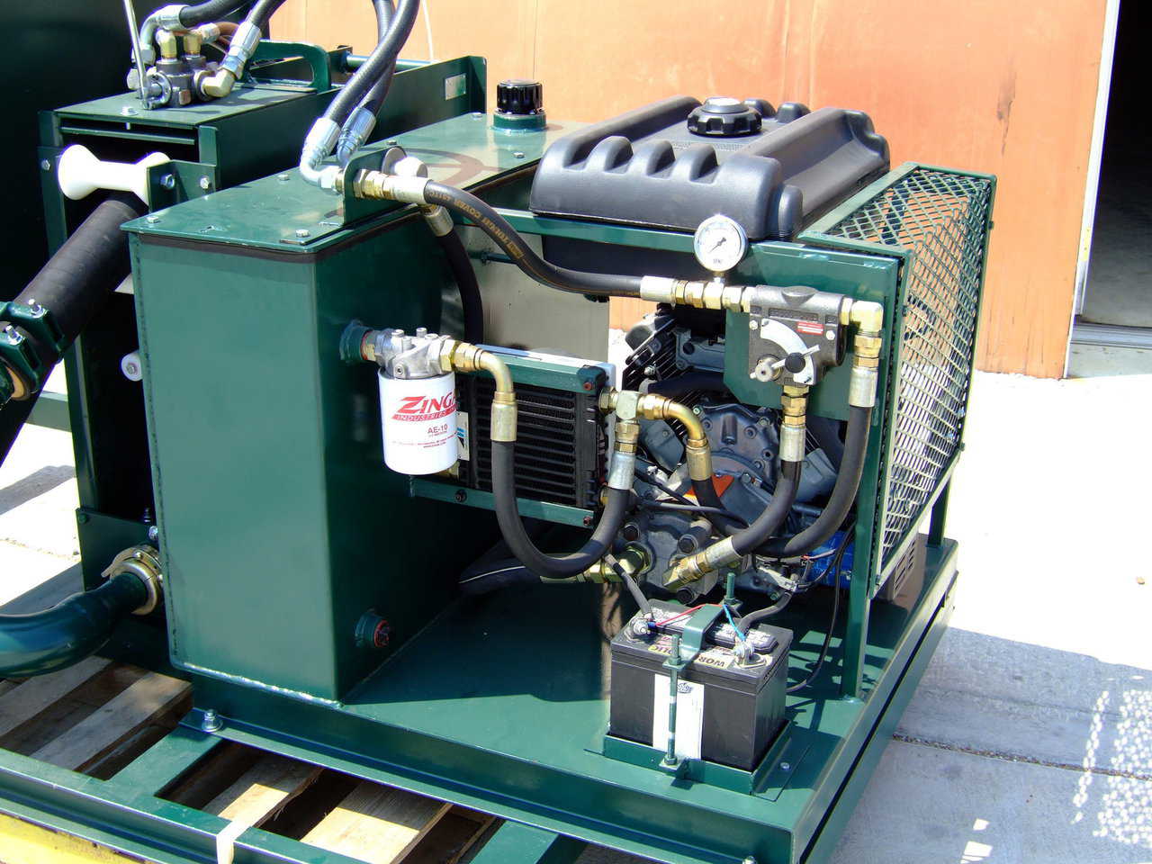 Power Unit — This 20 HP power pack is driven by a Honda motor and features a hydraulic cooling unit, variable flow control, electric start, and a 5 gallon fuel tank.