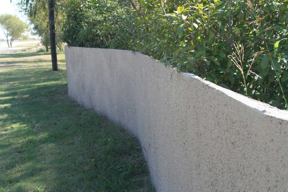 Spray-in-place security — Fence with washed aggregate surface