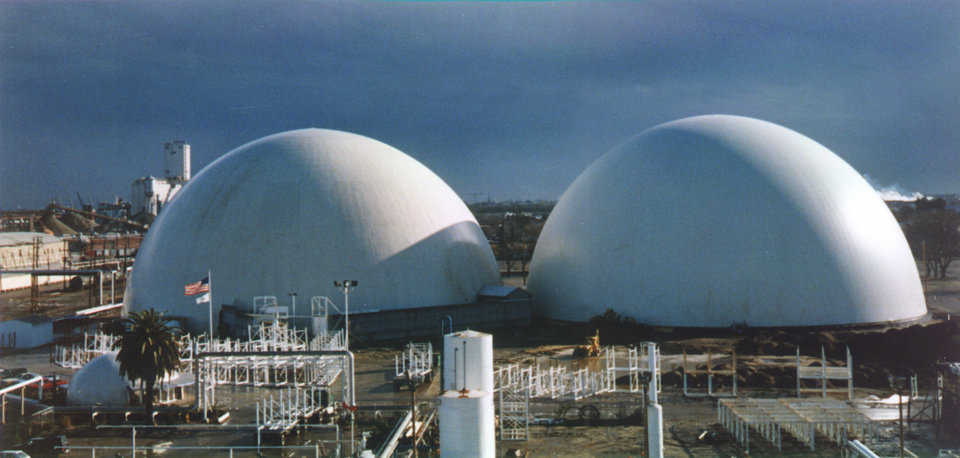 Apple Storage — In Stockton, California the California Ammonia Co. (CALAMCO) had Monolithic Domes, with diameters of 230’, heights of 115’ and the capacity to hold 600 semi-truck loads of apples, built and designed with a controlled atmosphere. Their oxygen is removed and replaced with nitrogen so that the apples “sleep” until they’re shipped.