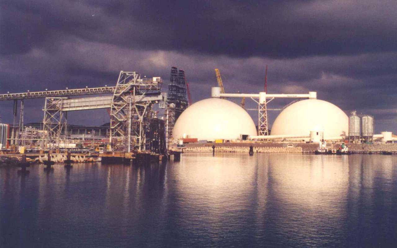 Petroleum Coke Storage — In St. Croix, US Virgin Islands, Hovensa Coker Storage, Bechtel Corp. has two 254′ × 127′ Monolithic Domes. With a capacity of 40,000 metric tons, they’re the world’s largest petroleum coke storages. After this photo was taken, an equipment tower and conveyor system was set on top of the domes. The weight allowance was one million pounds.