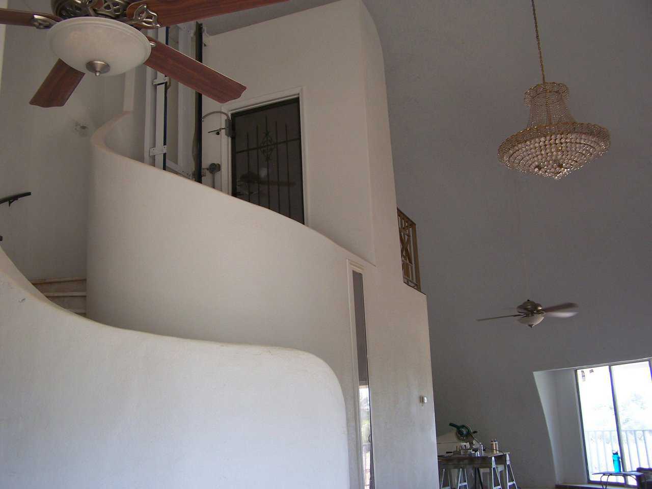 A wraparound staircase — The focal point of the dome is a gracefully flowing staircase that wraps around the elevator leading to the third level.