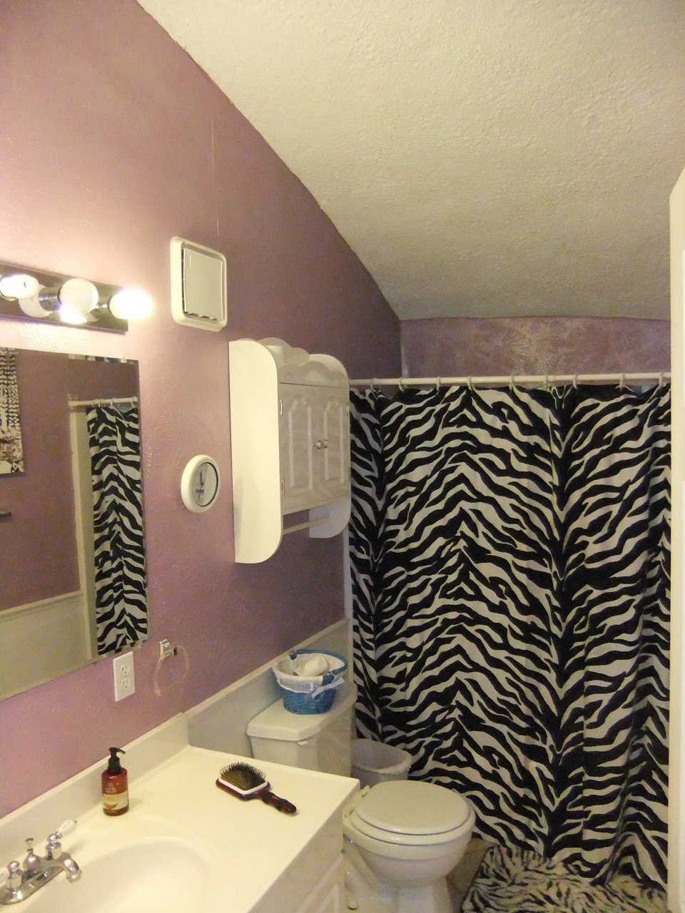 Bathroom — It has a tub and shower.