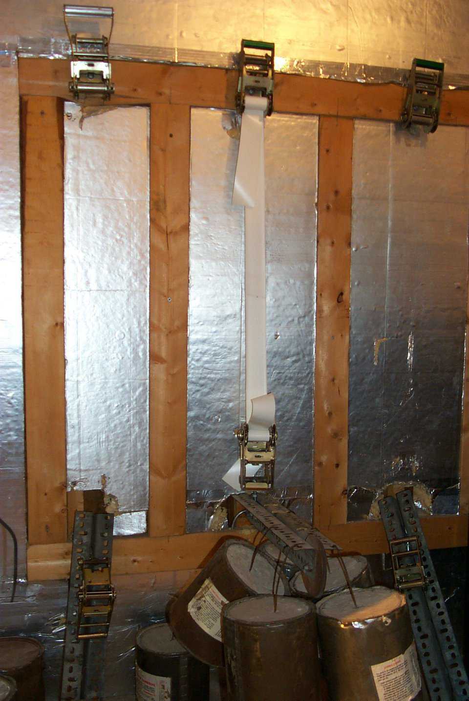 Test chamber — Inside look of the heated test chamber for testing stretch and failure of fabrics. Note the fabric is put under tension in this 140 degree F chamber for 24 hours.