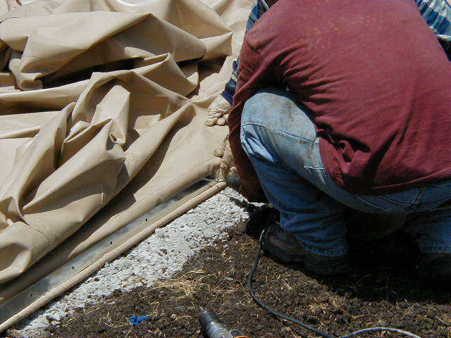 Attaching airform — Airforms can be attached a number of ways. The most common is a thin metal strap that is screwed on the outside with concrete screw anchors.