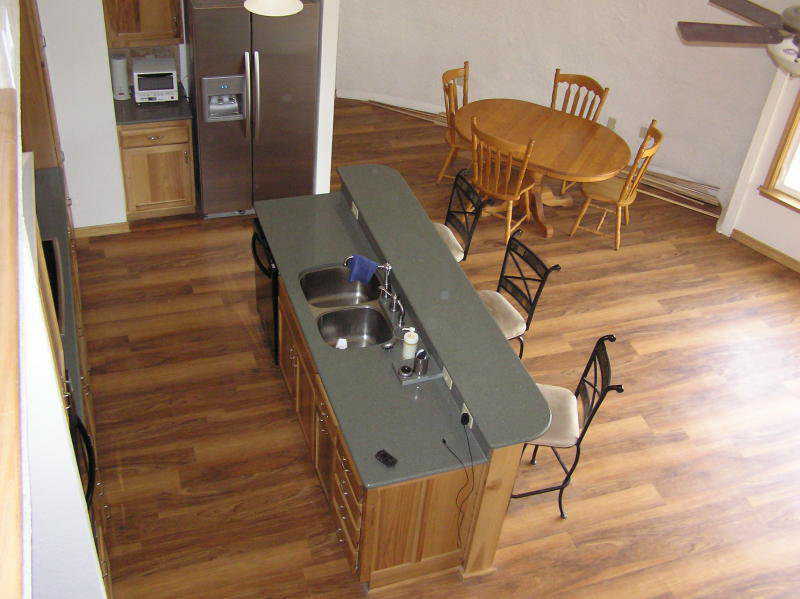 Floor — The wood in this easily maintained kitchen floor compliments the wood used for the cabinets.