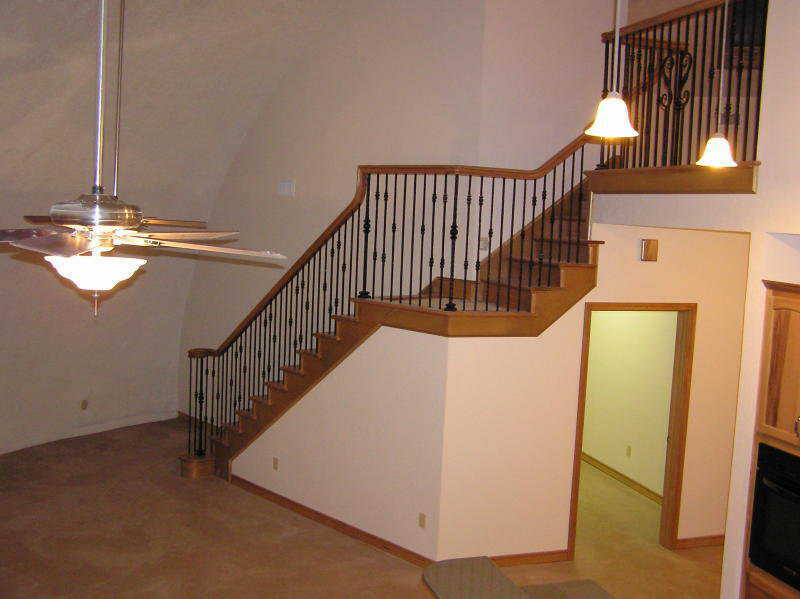 Heading up! — This lovely stairway leads to the loft. Its banister and stair treads are made of red oak.