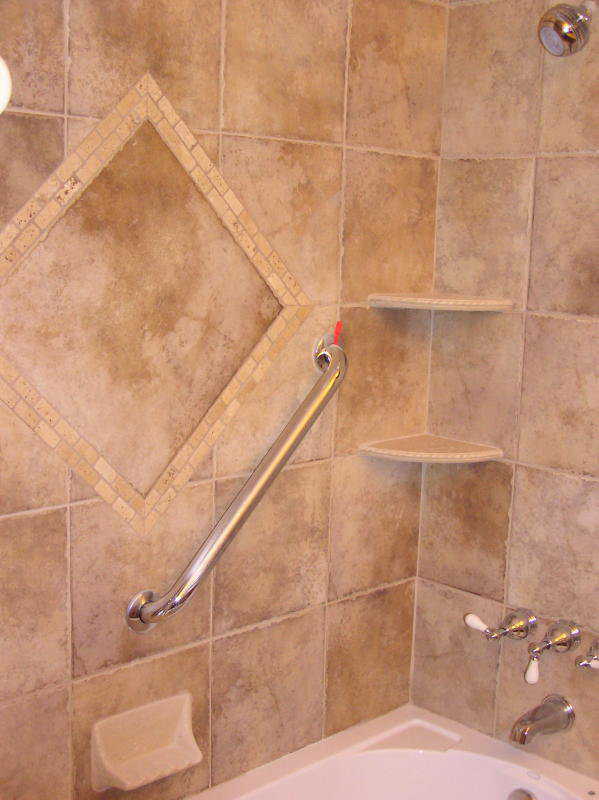 Shower — The tile shower in the master bath includes a built-in shelf and safety rail.