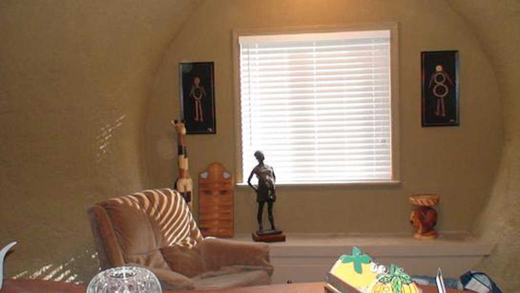 Living room — It’s cozy, well lit and decorated with Jamaican art.