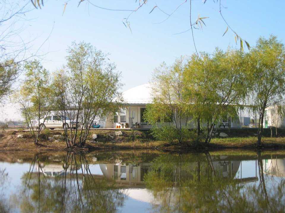 Sparkling pond — The Callisto reflects itself in the sparkling pond just a few feet away from its patio.