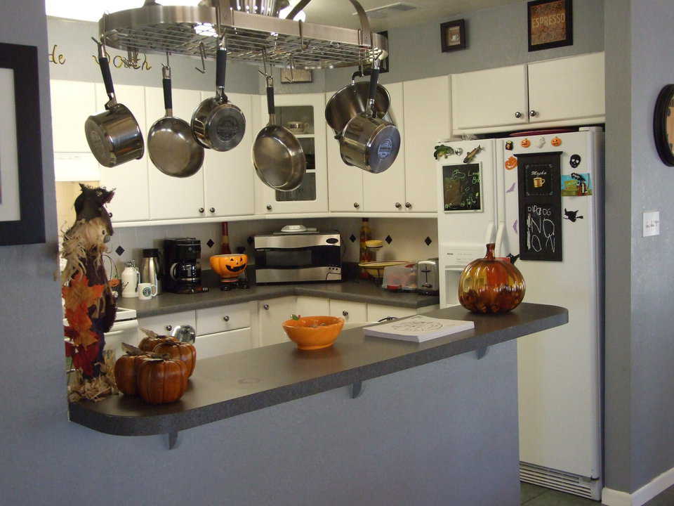 Kitchen — Easy-to-reach preparation areas and hanging cookware make this kitchen an easy and enjoyable workplace.