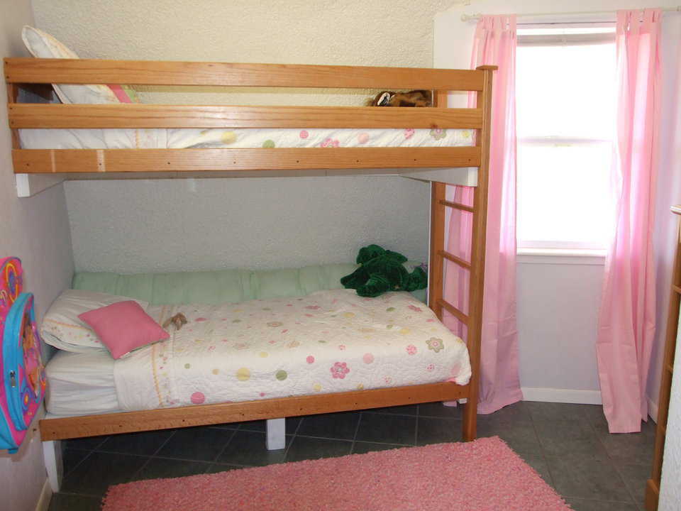 Girls’ bedroom — Lots of frilly pink here.