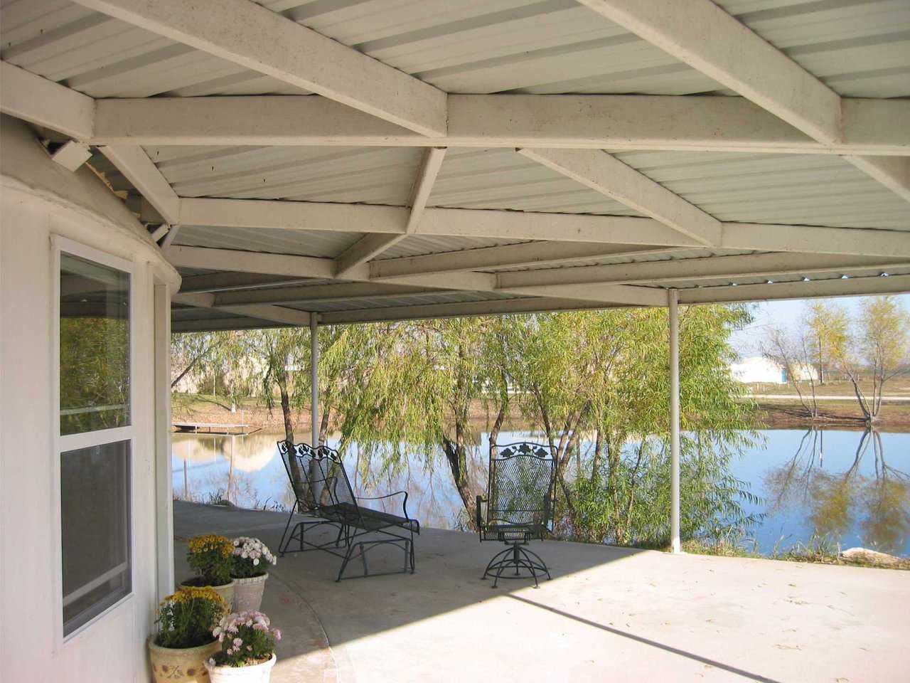 Patio — The living room windows provide a view of this spacious, relaxing patio.