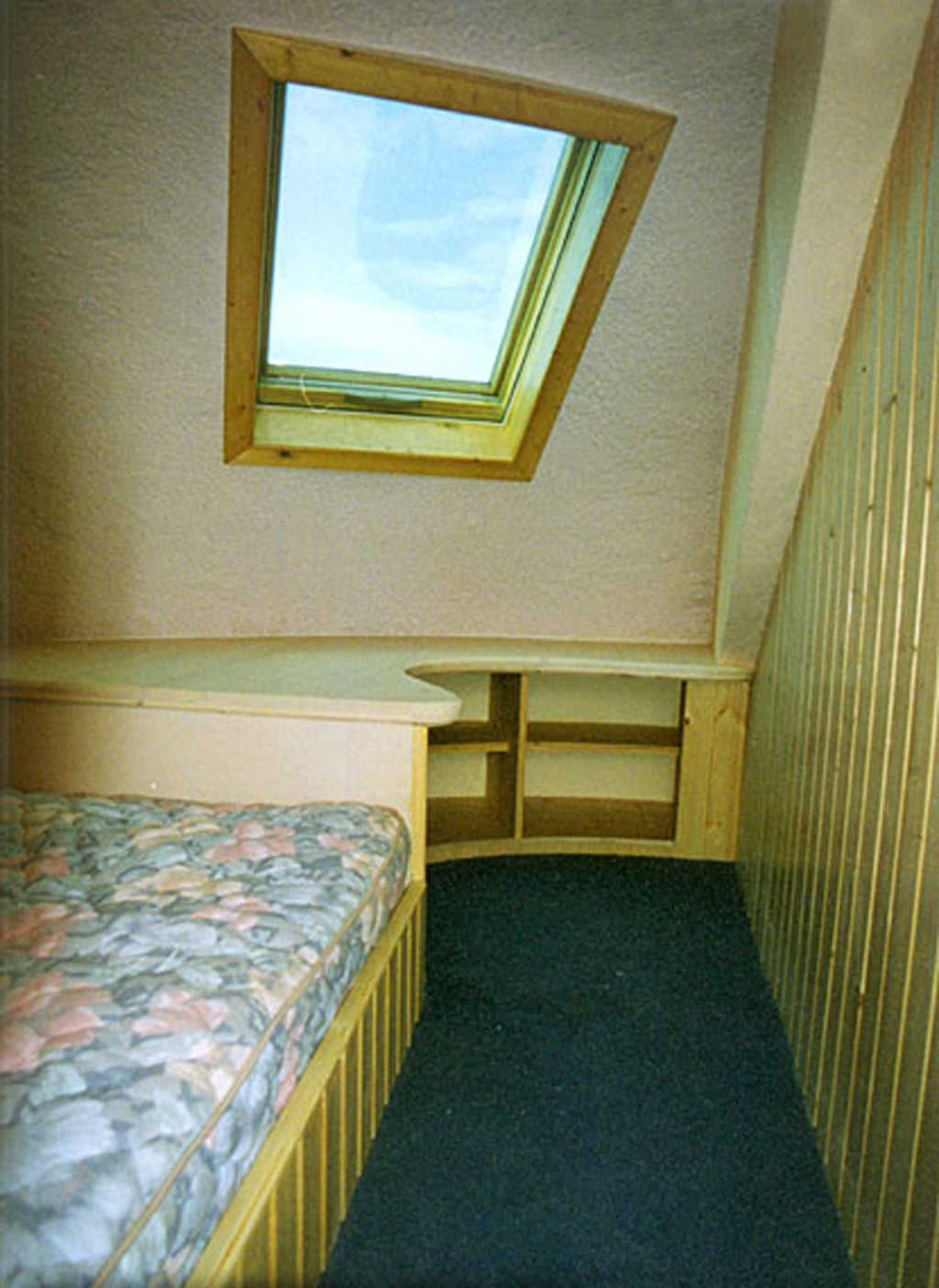 Upstairs bedroom — Both bedrooms include built-in beds and desks.