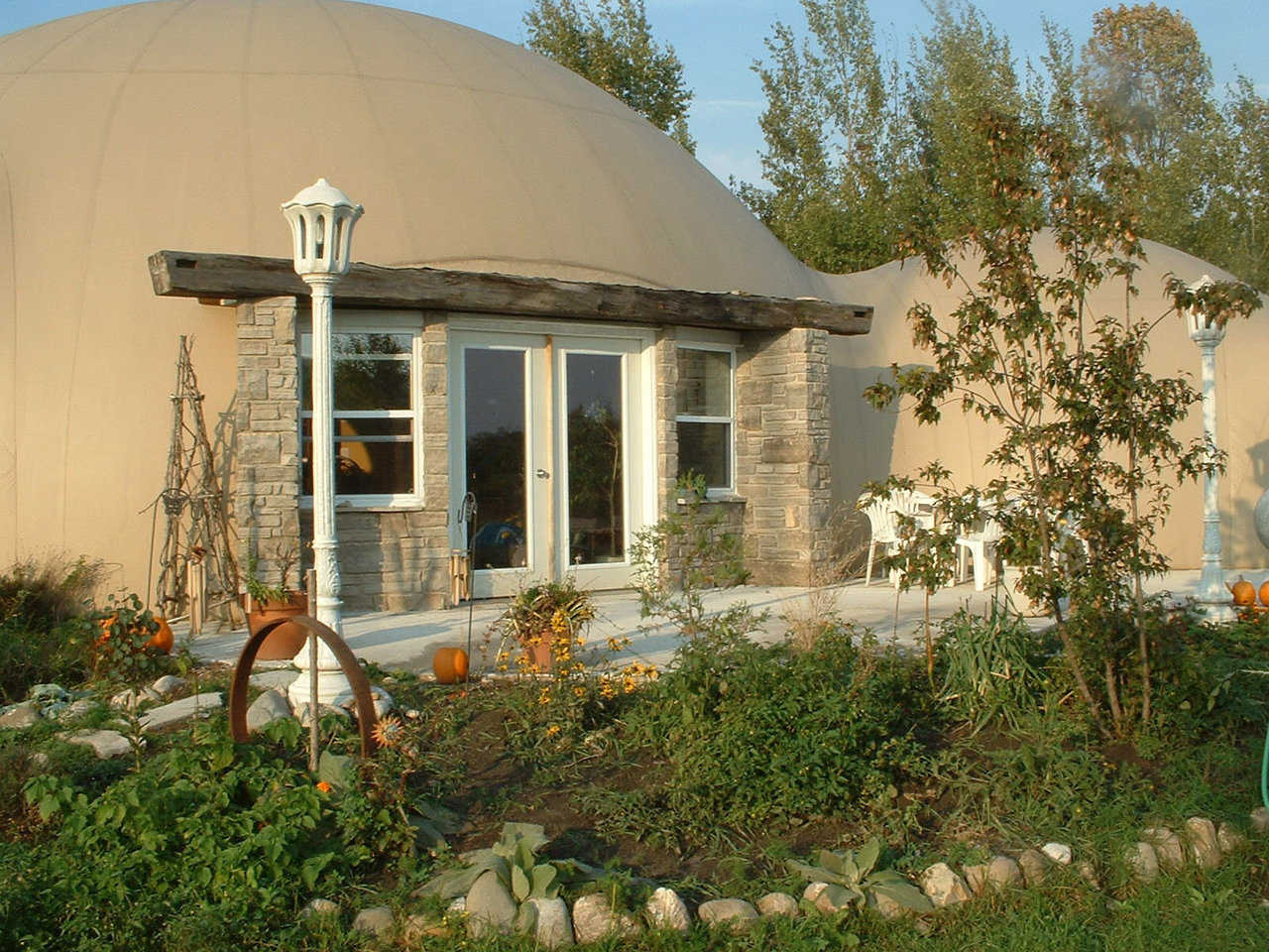 Monolithic Dome Dream Home — Rebecca and Sunny Cushnie of Southampton Ontario, Canada enjoy these two interconnected domes. The larger dome includes the main living/dining area, a kitchen, laundry room and two bedrooms. The smaller come encompasses the master suite.