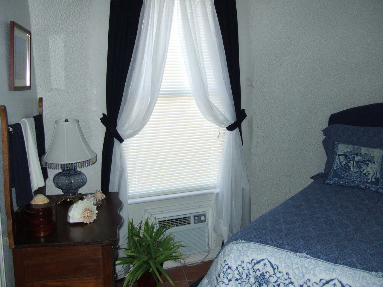 Good Night! — Soft-blues, whites and black create a relaxing environment in this bedroom.