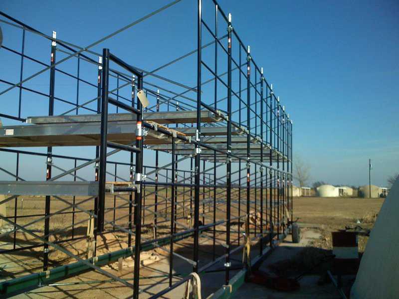 Second level up now — Second level of scaffolding has been installed.