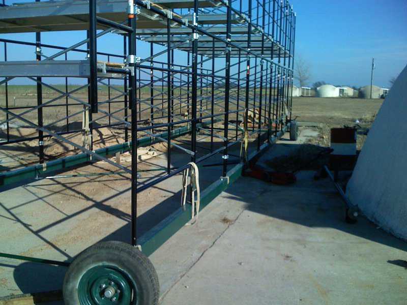 Straps on bottom beams — We used straps to hold the scaffold down to the beams.