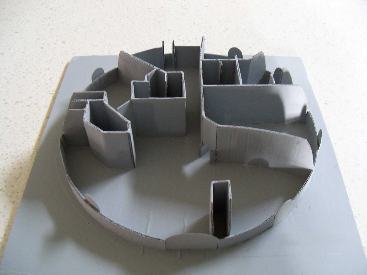 3-D Model — After brainstorming their floorplan, the Ecker’s built this cardboard 3-D model to study how light and room area might appear in their finished Monolithic dome.