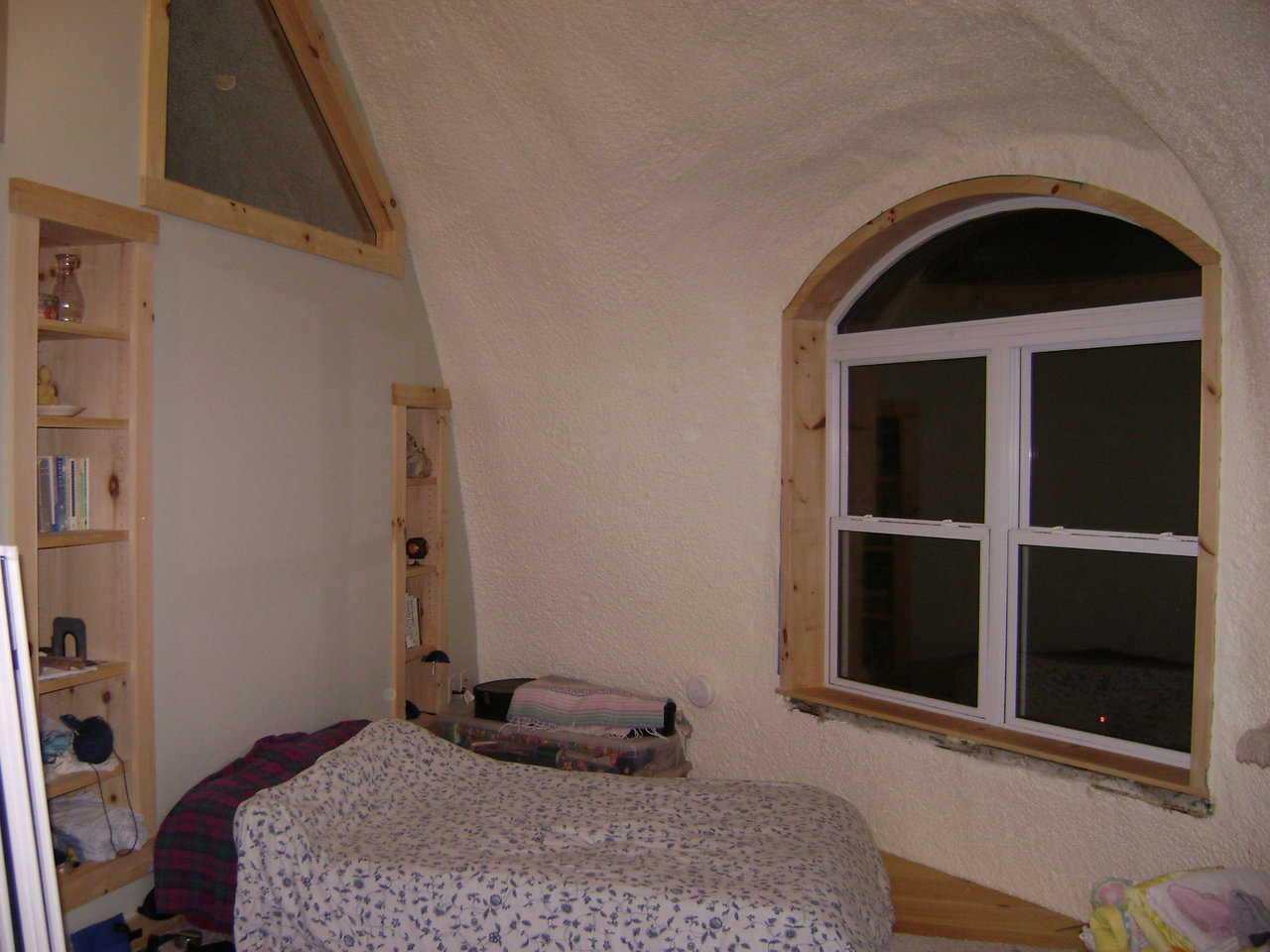 Part of master bedroom with book shelves