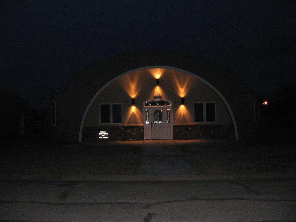 A welcoming light in the darkness! — Despite the hour or the weather, the Mudds feel safe and secure in their Monolithic Dome on the Prairie.