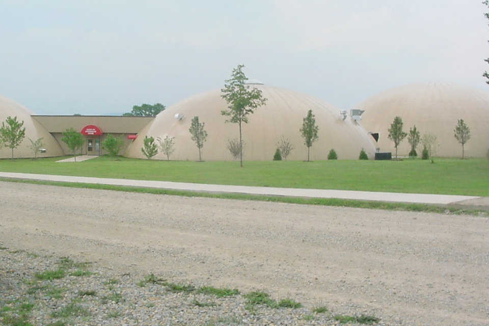 Fig 2.5 — During the 2007-2008 winter, Caledonia, Missouri experienced ice and wind storms that covered their area with two to three inches of ice and left people without power for up to two weeks.  Superintendent Steve Yount said that the domes were unaffected by the cold, and, although they were without power, the domes retained their heat, so people spent their days warming up in the Monolithic Domes.  The community wants their domes certified by the Red Cross as a designated disaster shelter and is looking into grants that would finance a generator.