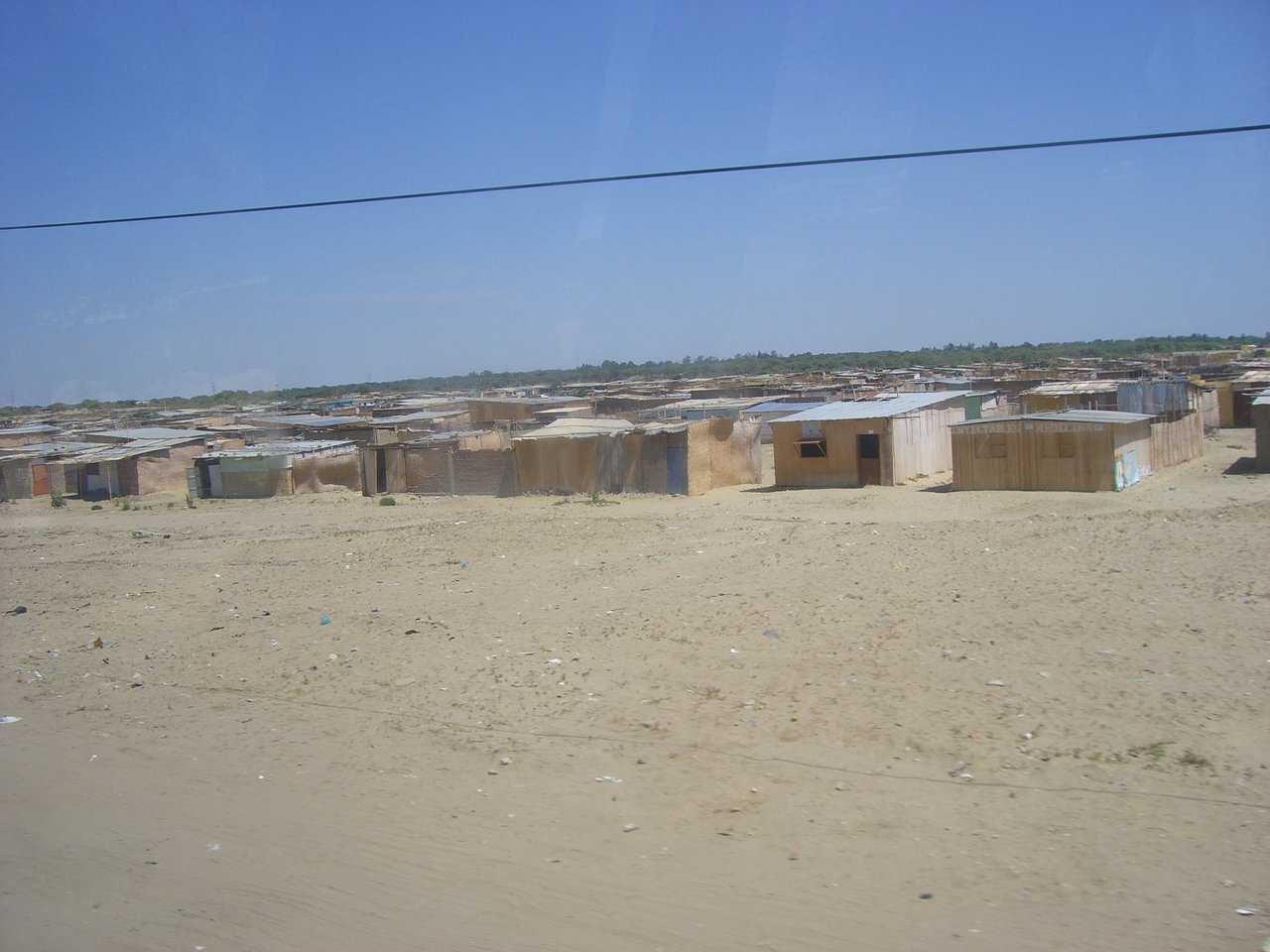 Current Housing near Piura — Currently areas like this are the only hope for many low-income workers.  This area stretched for nearly 8 miles.  Most of these are little more than straw mats with dirt floors, and little or no protection from rain and sun.