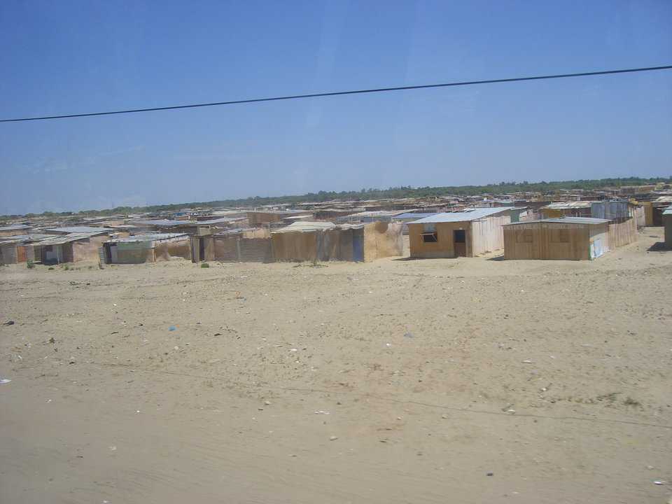Current Housing near Piura — Currently areas like this are the only hope for many low-income workers. This area stretched for nearly 8 miles. Most of these are little more than straw mats with dirt floors, and little or no protection from rain and sun.