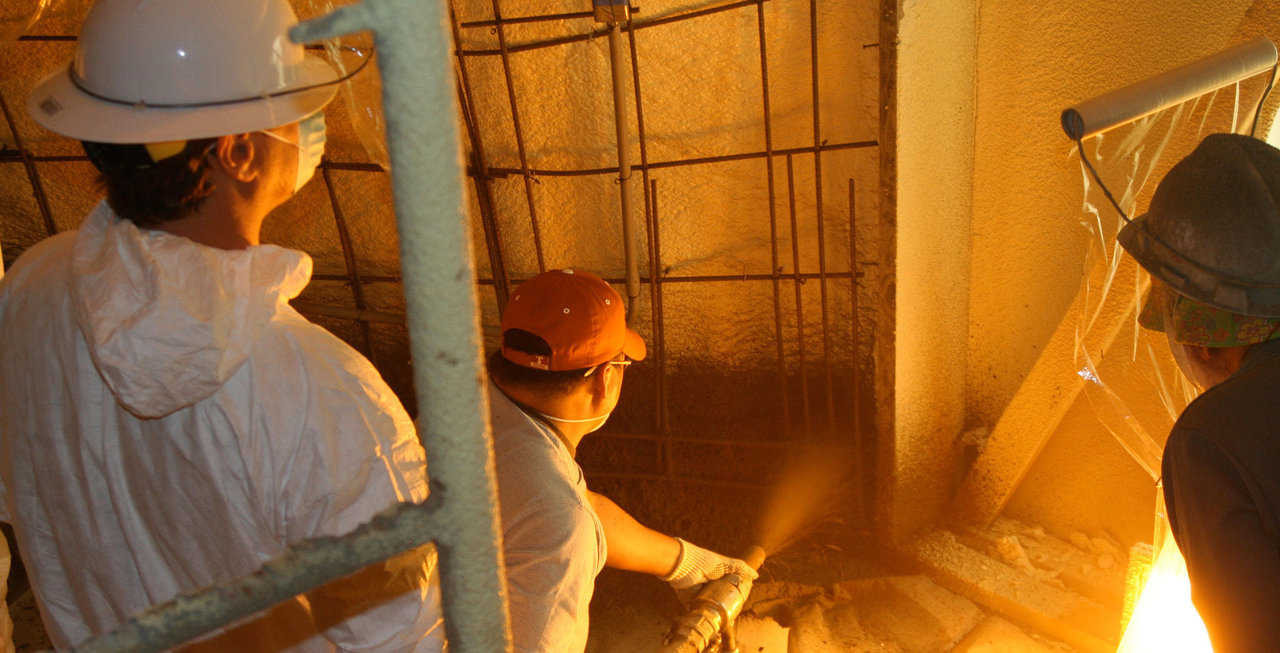 Applying Shotcrete — Workshop attendees get the opportunity to spray concrete on a Monolithic Dome during one of our Workshops.  The first layer of shotcrete gets sprayed on approximately 1/2" thick.