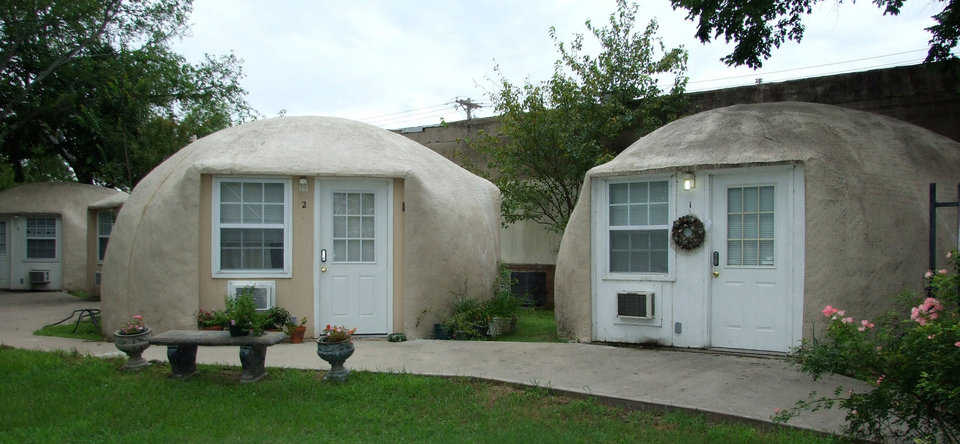 Rental Units — Nestled in the trees in Italy Texas, four IO-20’s make great 300 square foot rental units.  These four domes are coated with concrete using the chain-shell method.