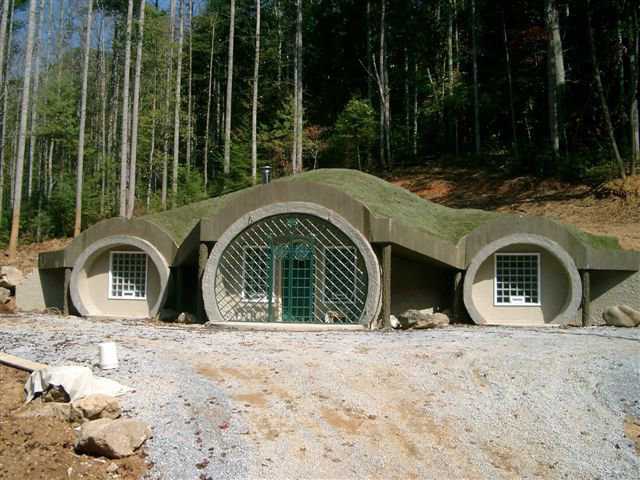 A Monolithic Dome Hobbit Home — The front entrance of this earth-bermed, Monolithic Dome home was designed to look like the entrance to a hobbit hole.