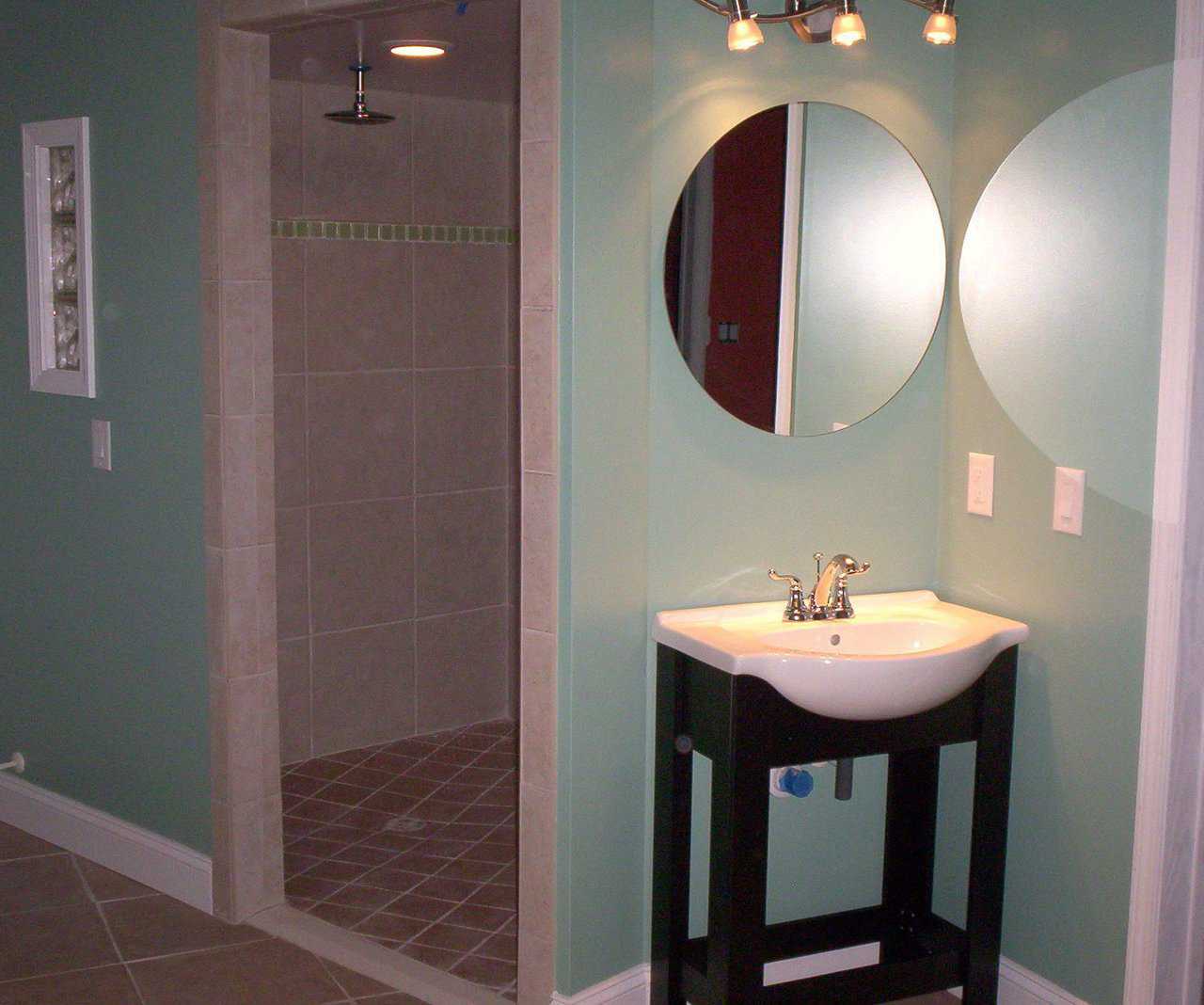 Master Bathroom — Bold tile and tile trim. Receptacles 30” off the floor. Tiles separated by a bright, non-slip threshold, turned 90 degrees on its axis to help see different spaces.  (Not pictured: anti-scald valves with large grip handles for no water burns and easier handling.)