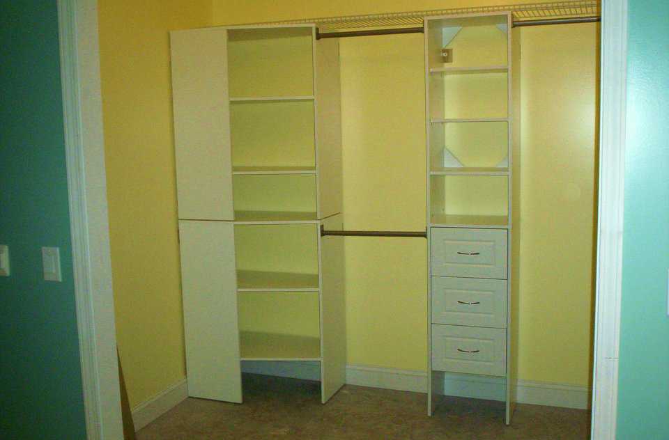 Large Closet Next to Master Bath — Pass-through closet allows room for walker and wheelchair entry, turnaround  and staging during bathing. Bright colors provide contrast between clothes, shelves and walls. Wire top rack permits seeing items stored higher. Open cabinets allow easy access.